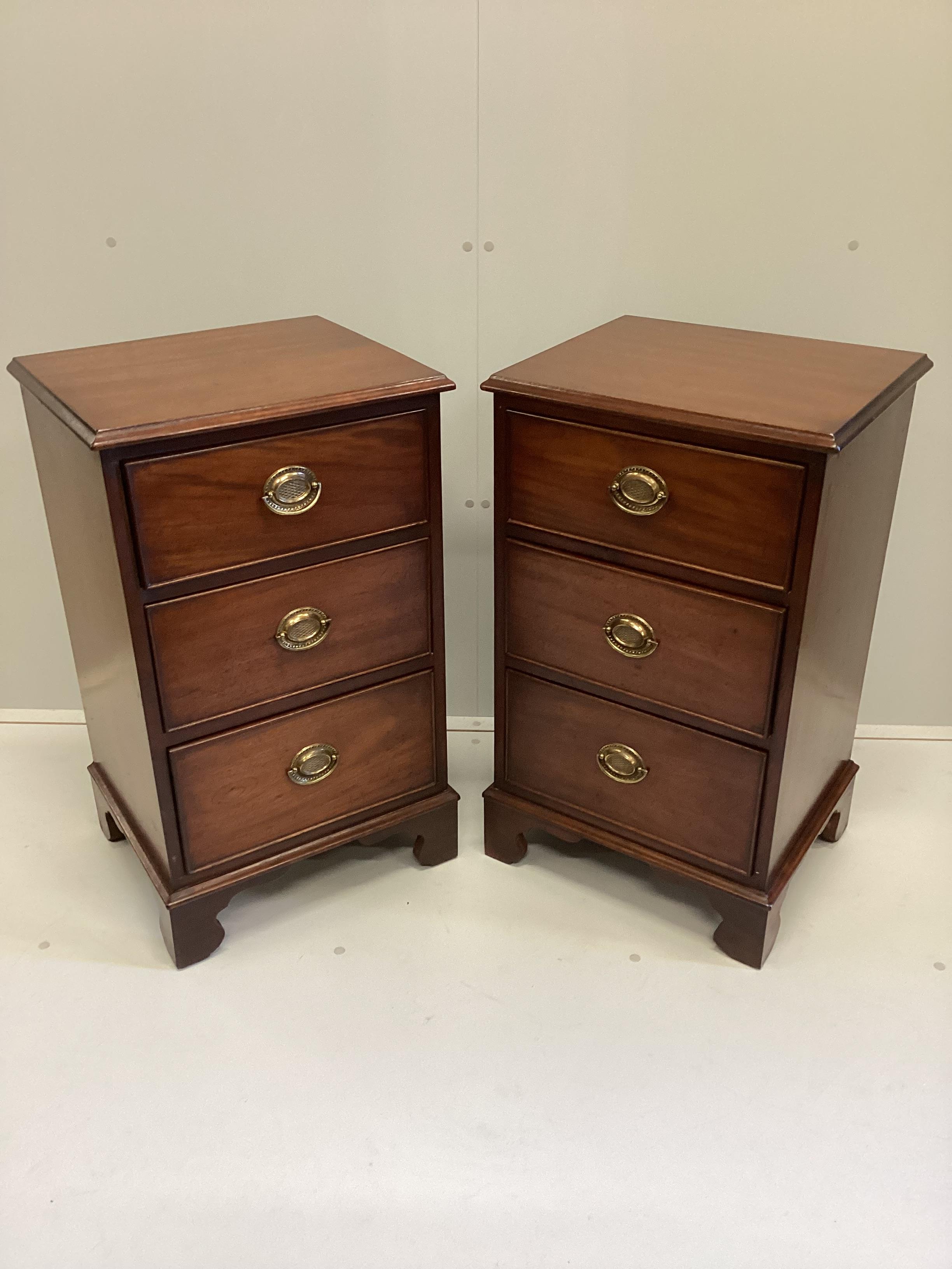 A pair of George III style mahogany three drawer bedside chests, width 47cm, depth 40cm, height 80cm